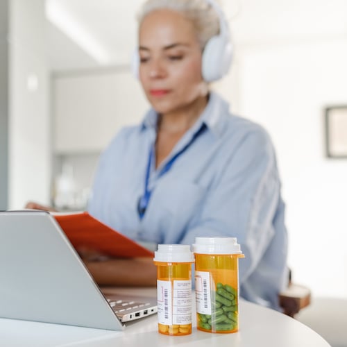 woman with prescription bottles