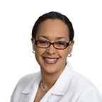 Imani Williams Vaughn, Family Physician, African-American with a short hair wearing glasses